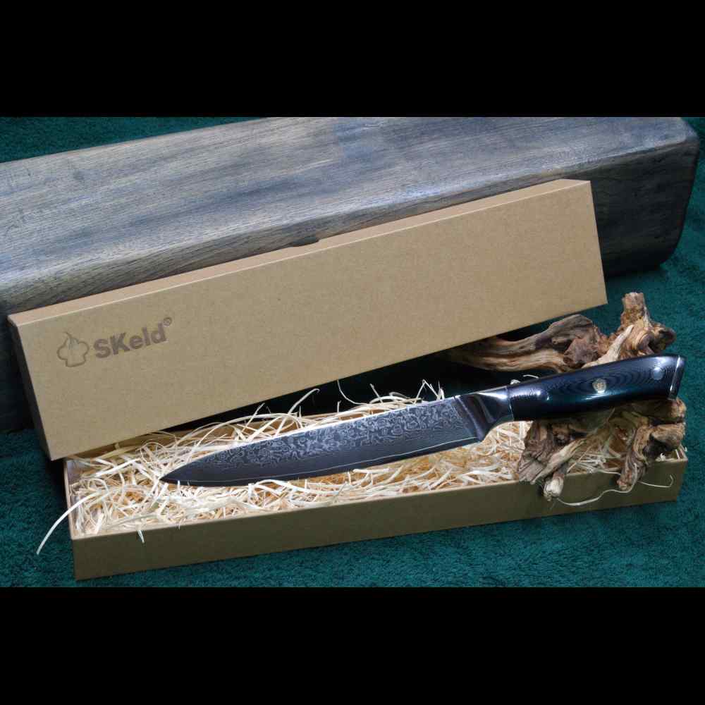 SKeld® Geschenkbox mit Holzwolle-Polsterung und Damast Tranchiermesser mit schwarzem G10-Griff